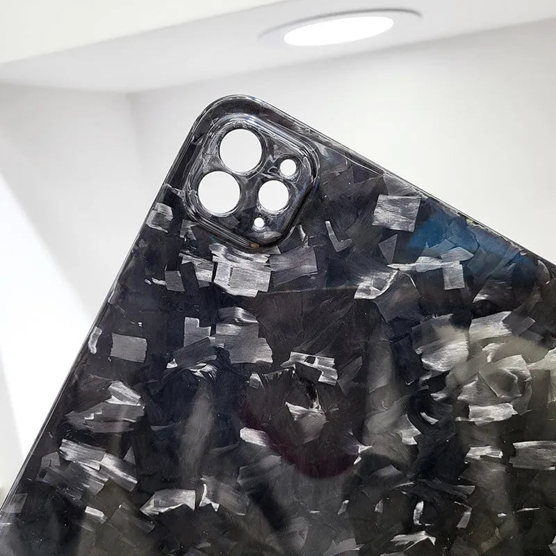 Genuine carbon fibre hard protective case for Apple iPad Pro 11 on a table.
