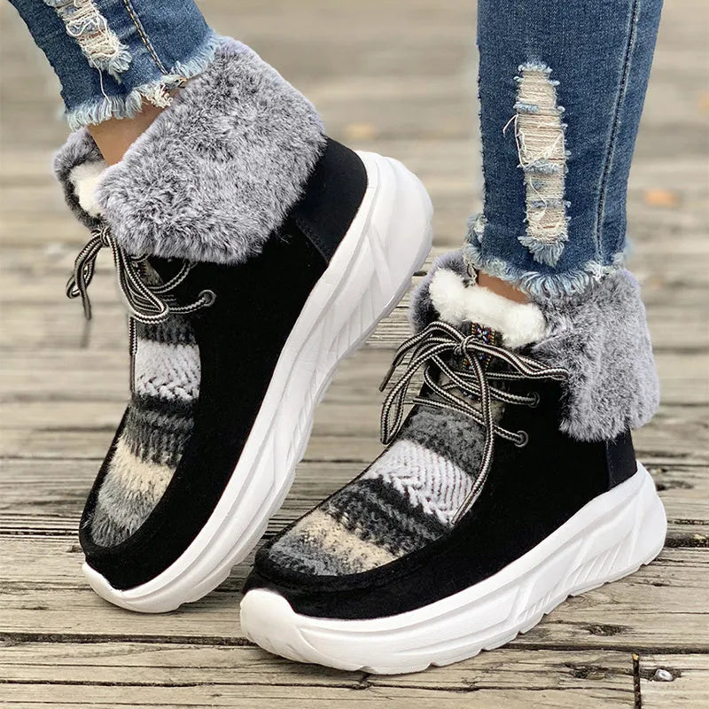 Beige women's lace-up mid-top snow boots with suede upper and thick rubber sole.