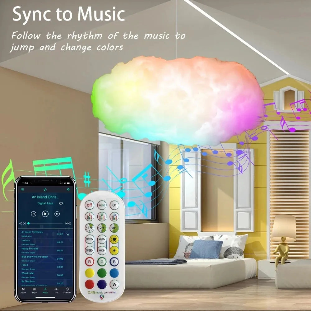 White fabric cloud shaped ambient light with colourful LED lighting, hanging from ceiling with USB cable.