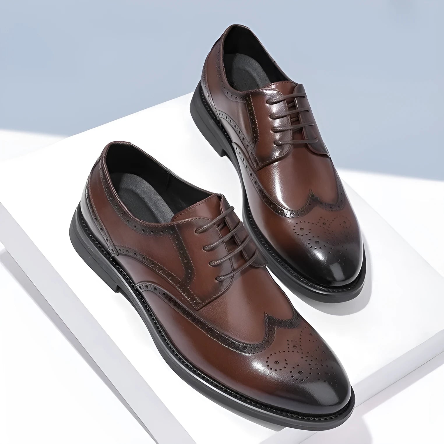 Men's black and brown brogue business shoes with traditional perforated detailing on PU leather upper