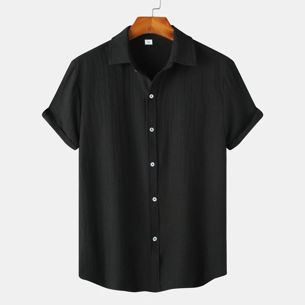 Man wearing a casual short-sleeved polyester shirt in a cardigan style, available in multiple colours.
