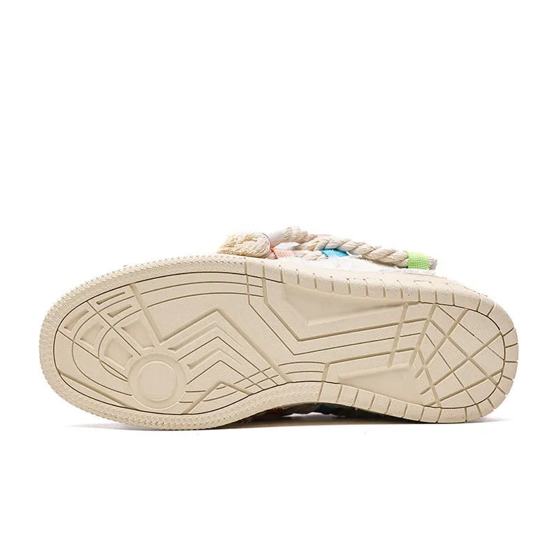 Creamy white retro low-top skateboard shoes with a platform sole and lace-up fastening.