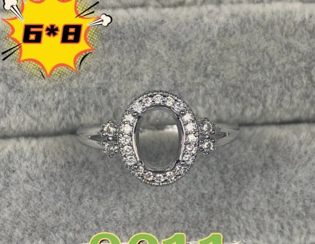 Oval denier ring with 6x8 mm stone and five-pointed star accent on open mouth copper band
