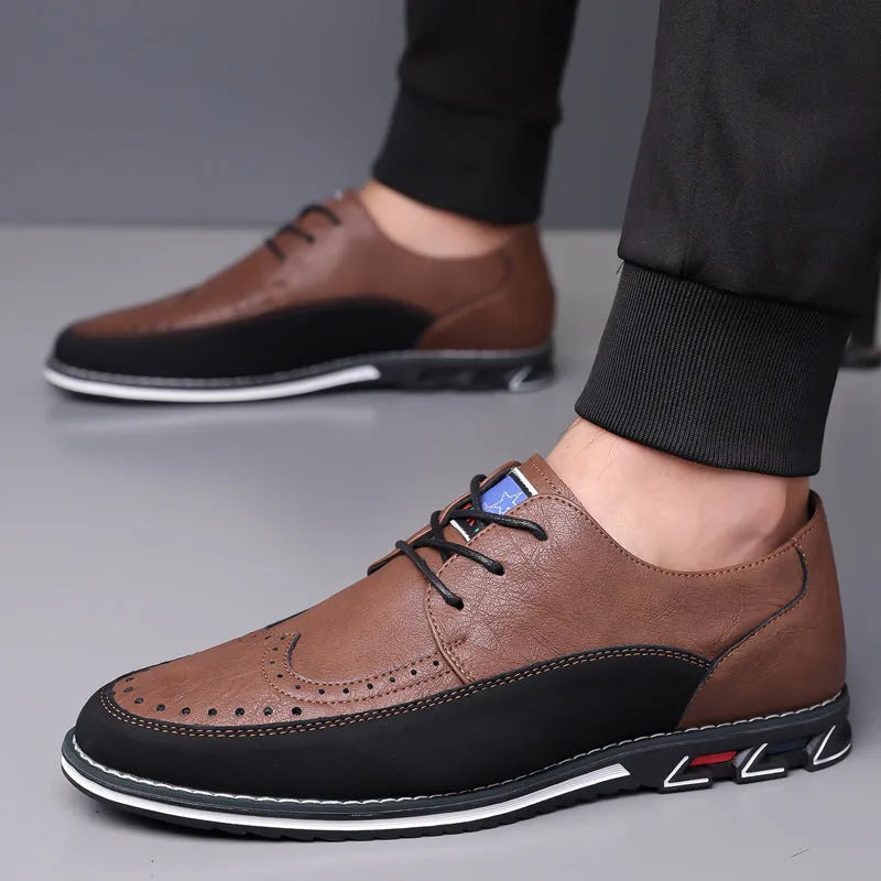 Men's black leather-toe casual shoes with fabric upper and rubber sole on a plain background.