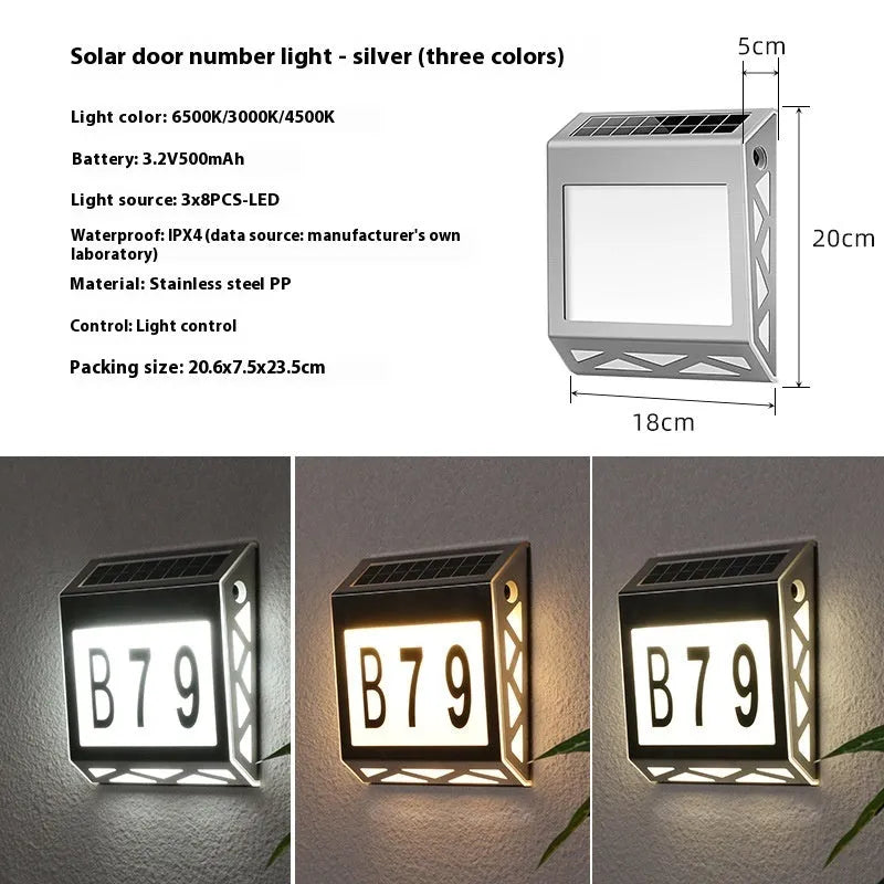 Black solar powered doorplate light with digital LED display showing house numbers