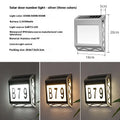 Black solar powered doorplate light with digital LED display showing house numbers