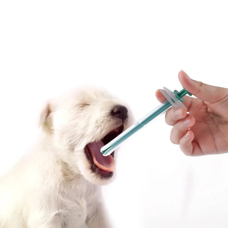 Two pet pill shooters with soft silicone tips for administering cat and dog medicine.
