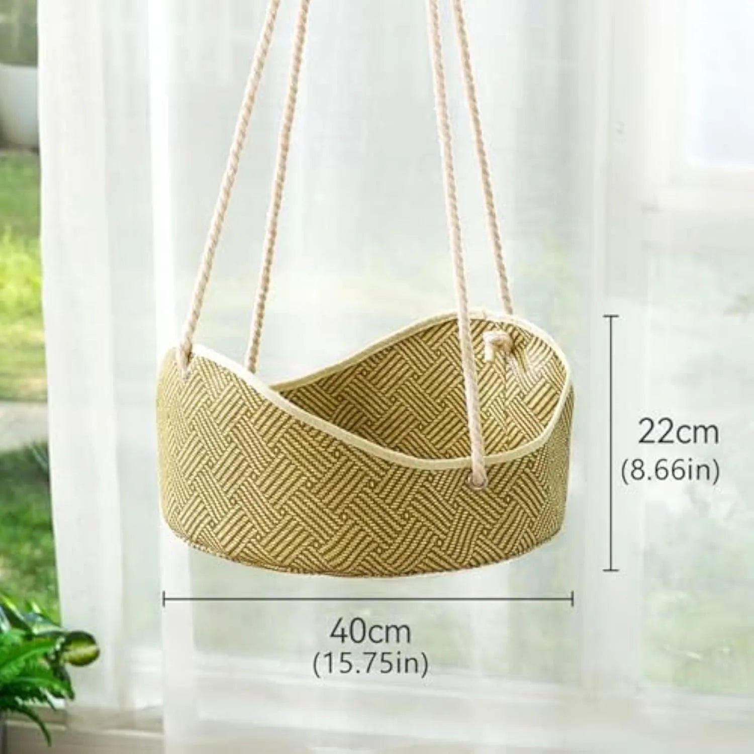 Green rattan cat hammock with cotton ropes and metal hooks, shown hanging