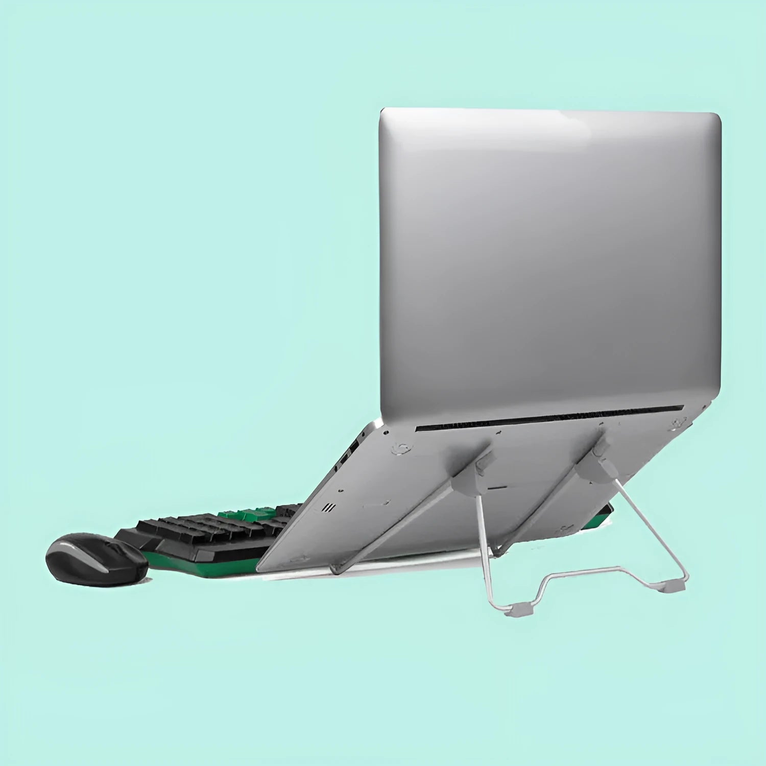 Grey foldable aluminium and plastic stand holding a mobile phone and a laptop on a desk.