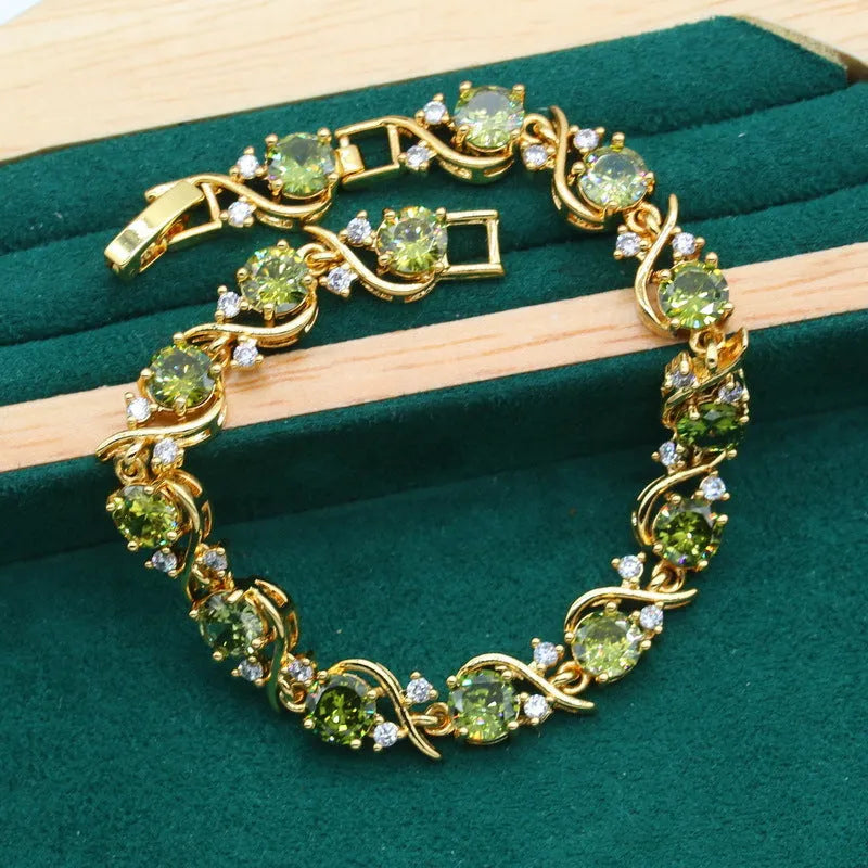 Women's rhinestone zircon jewellery set with cross, crown, and Roman numeral designs on a snake bones chain.
