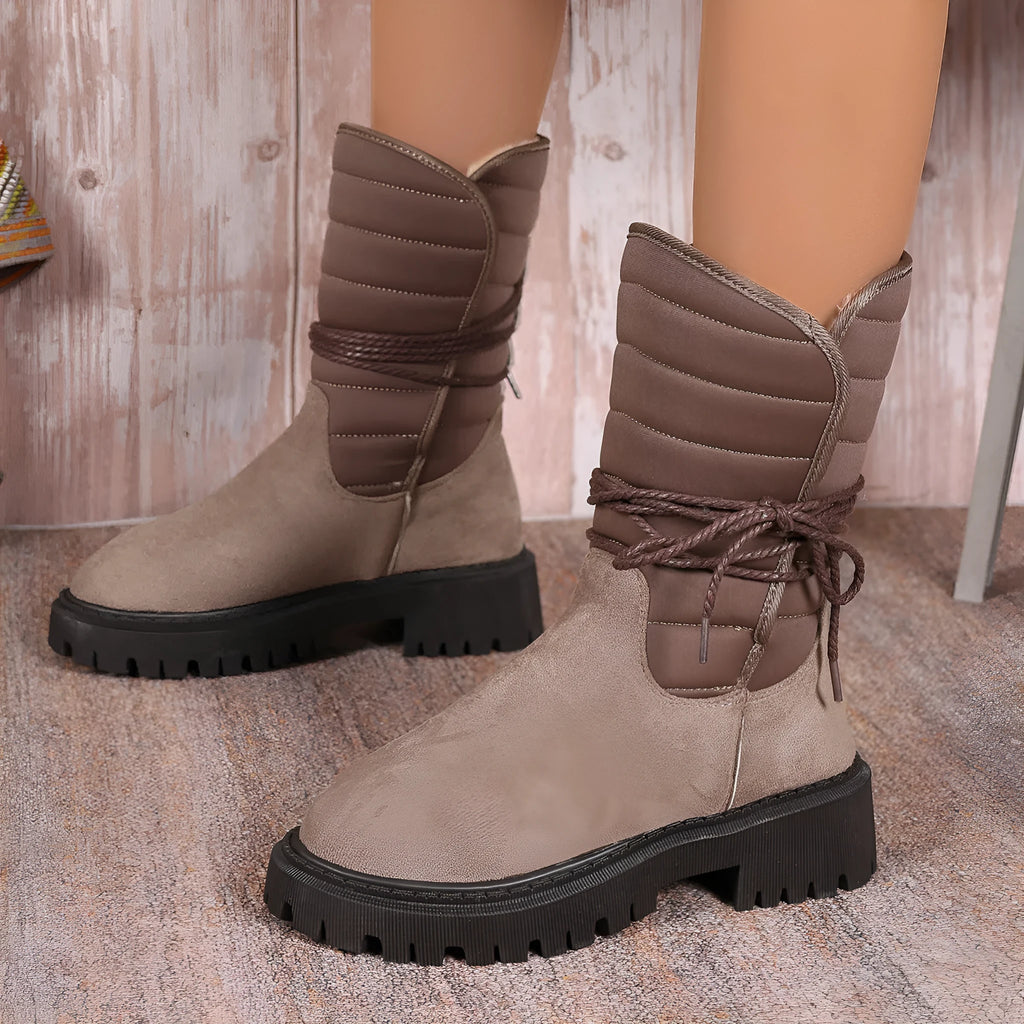 Women's black suede high-top winter boots with a chunky heel and lace-up front, fleece-lined.