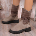 Women's black suede high-top winter boots with a chunky heel and lace-up front, fleece-lined.