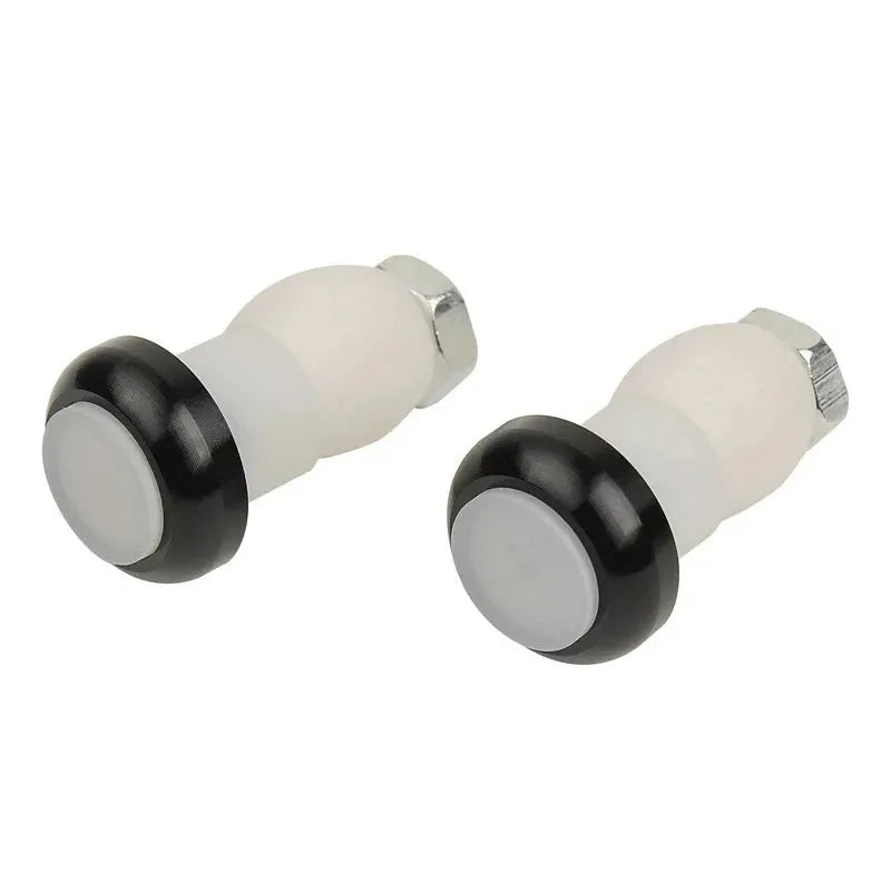 A pair of anodised aluminium bicycle handlebar end lights in a choice of colours, showing the red LED and white rubber switch.
