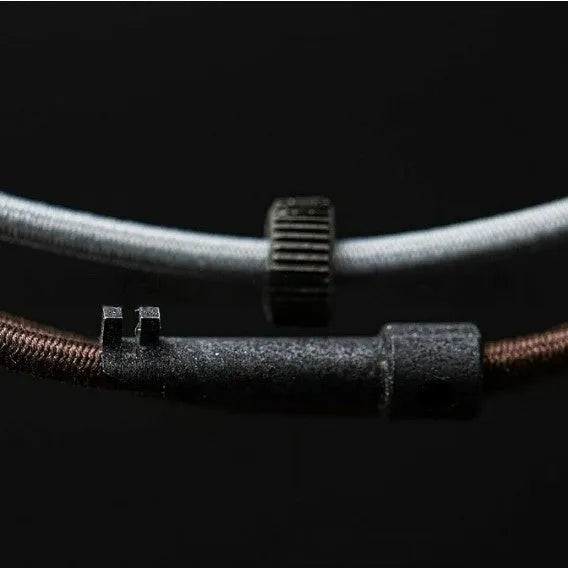 Lightweight wild rubber survival bracelet on a neutral background showing modern simple design