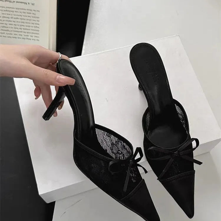 Women's lace-inspired pointed toe high heels with a bowknot detail on the mesh upper.