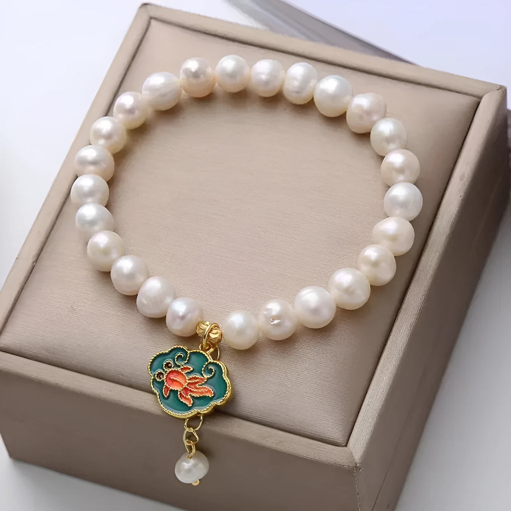 White freshwater pearl goldfish and lotus bracelet with vintage baroque design on delicate chain