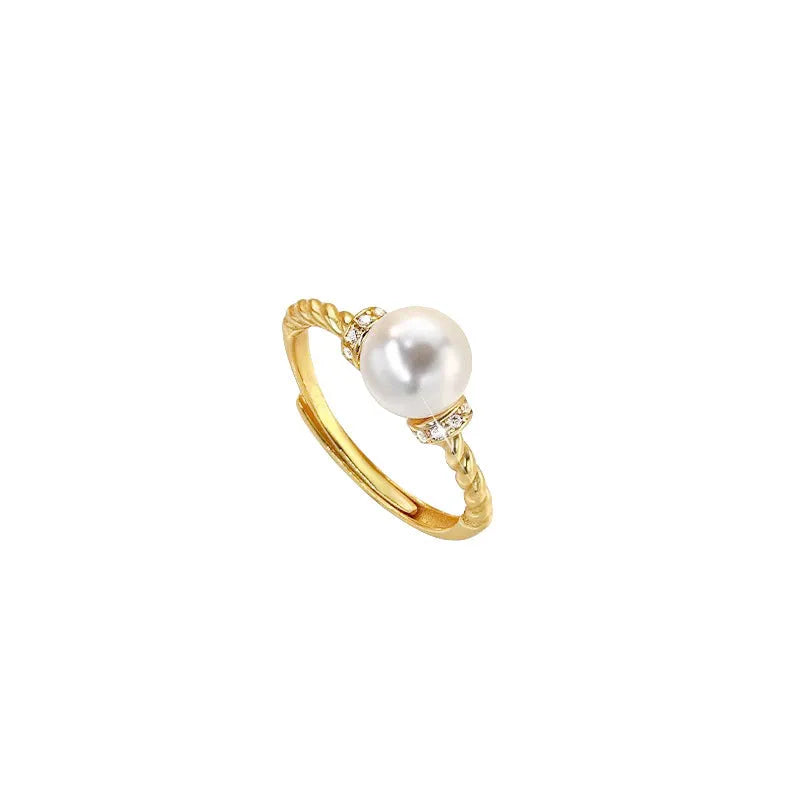 Adjustable antique twist copper ring with geometric pearl inlay in gold and silver colours.