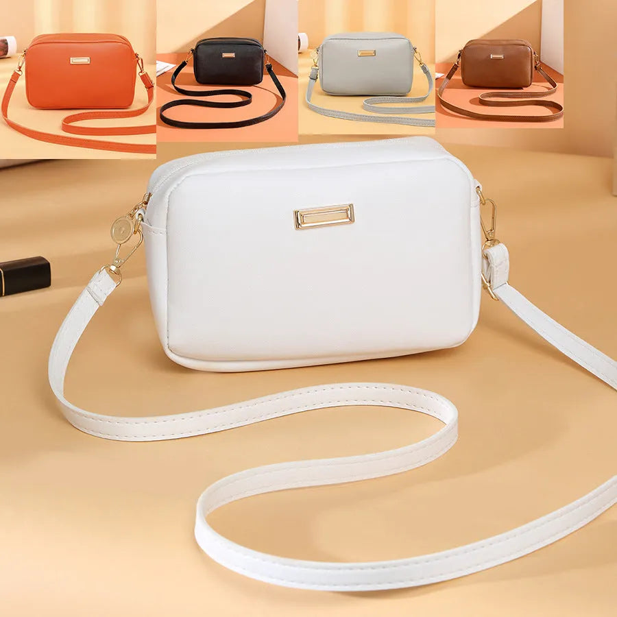 Solid colour PU ladies' shoulder bag in urban simplicity style with three-dimensional pocket.
