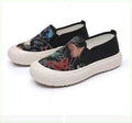 Women's black and white slip-on canvas shoes with round toes and plastic soles