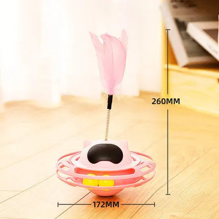 Pink cat tumbler turntable toy with self-moving rotational action for interactive feline play