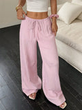 Women's wide-leg black trousers with a lace-up detail on the mid-rise waist