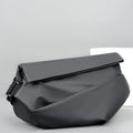A medium-sized grey crossbody bag for men made from PU leather with a single shoulder strap.