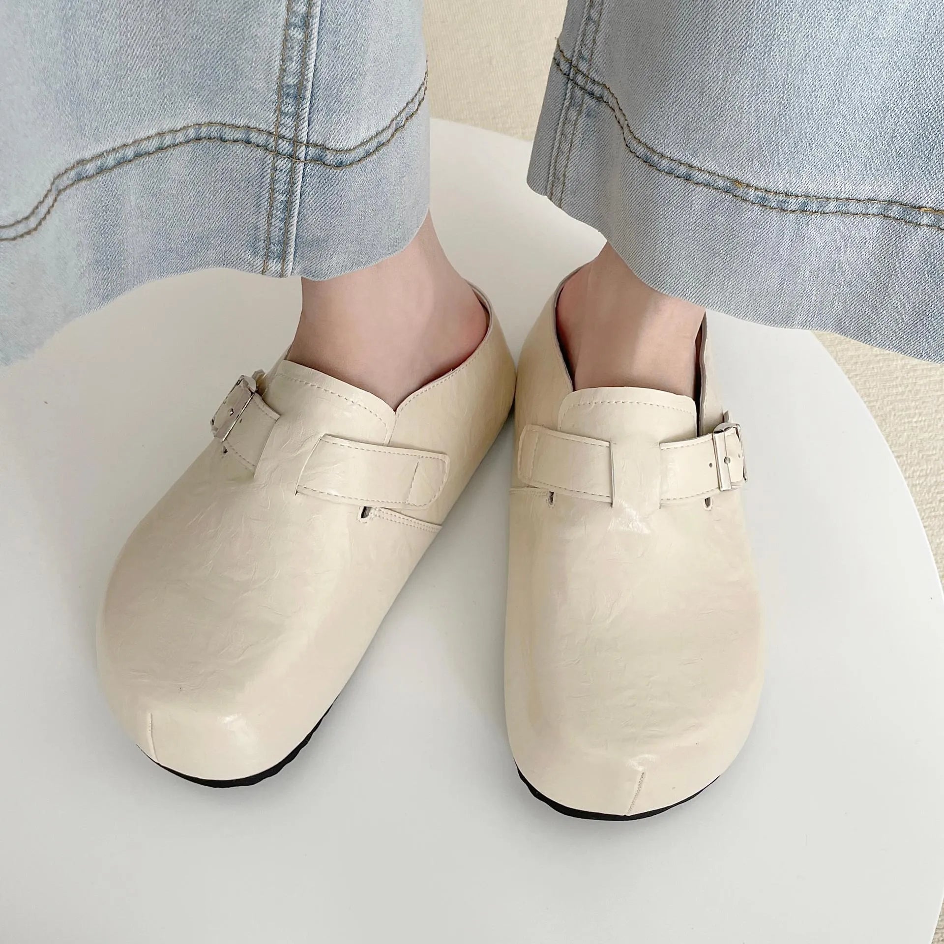 Flat buckle casual sneakers with round toe in yellow, creamy-white, silver, and black colours