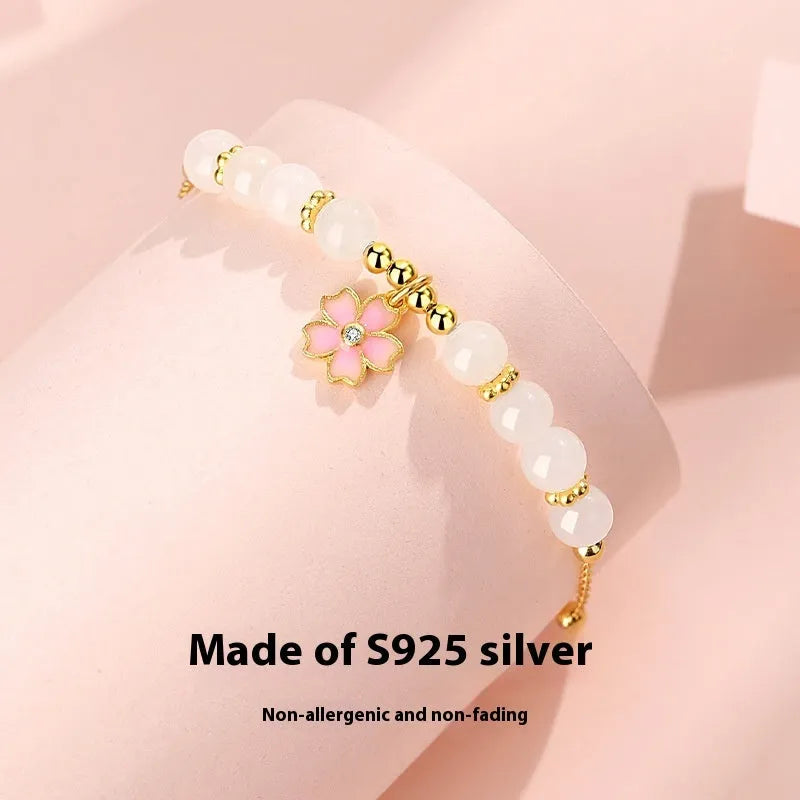 Pink gradient Hetian jade and 925 silver bracelet with epoxy cherry blossom pendant.