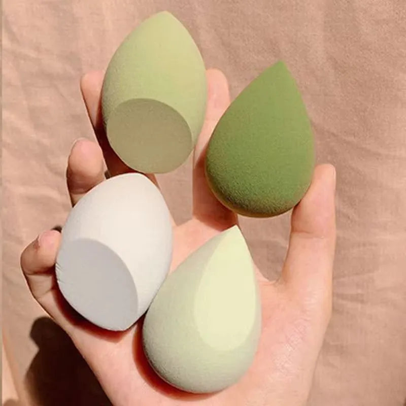 Set of 10 nude, pink and rose red hydrophilic non-latex makeup sponges in bevel drop and peach heart shapes.