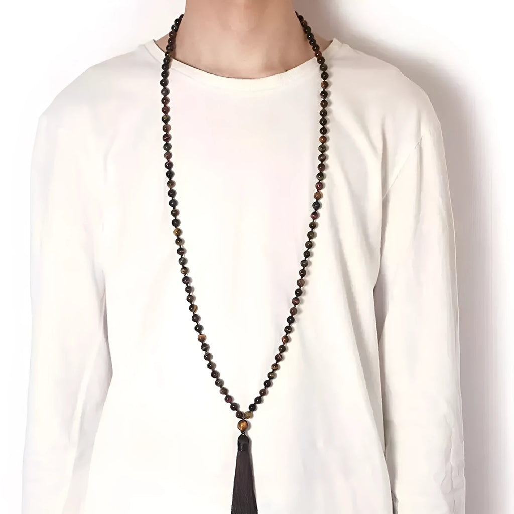 Long geometric agate and gemstone tassel necklace showing colourful beads including amethyst and lapis lazuli.