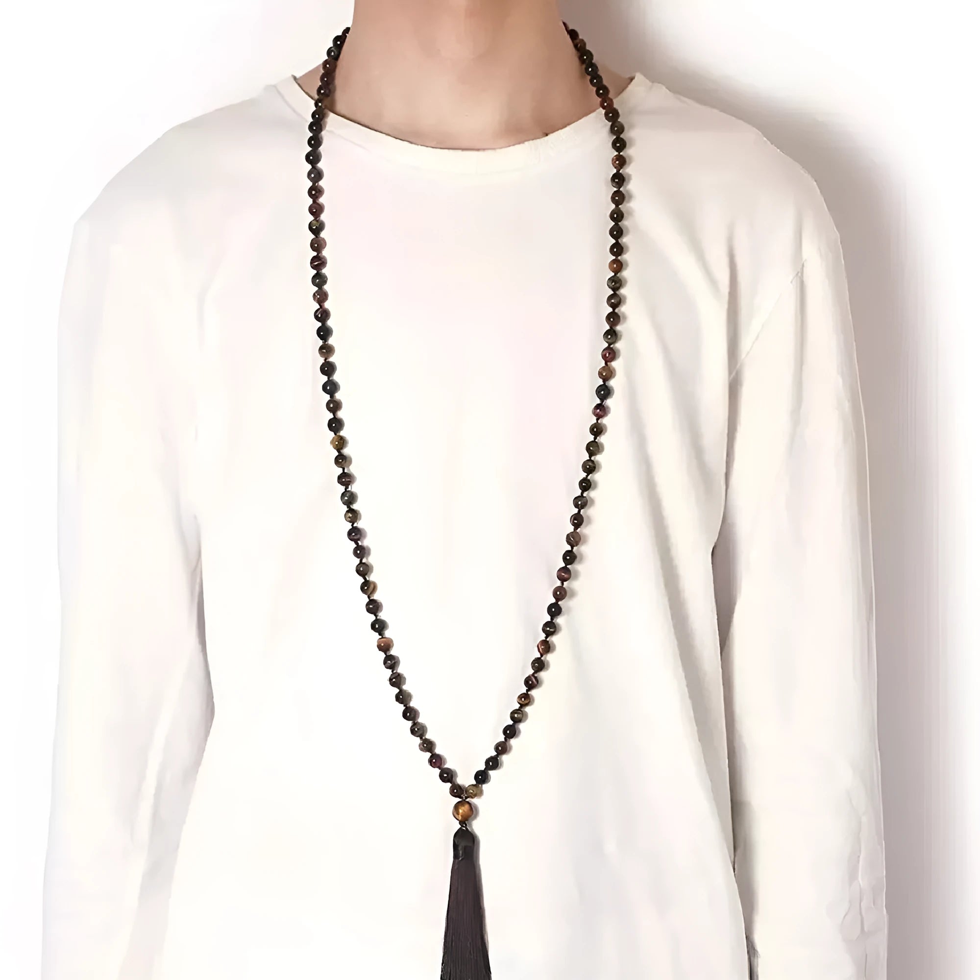 Long geometric agate and gemstone tassel necklace showing colourful beads including amethyst and lapis lazuli.