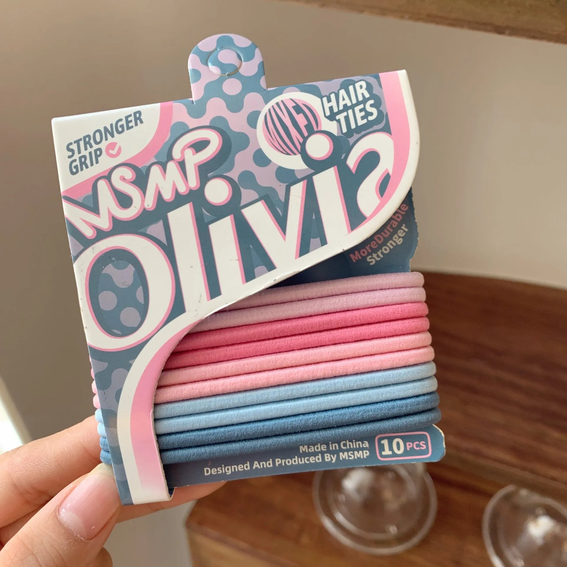 Assorted candy colour braided elastic hair bands laid flat, showing no metal parts.