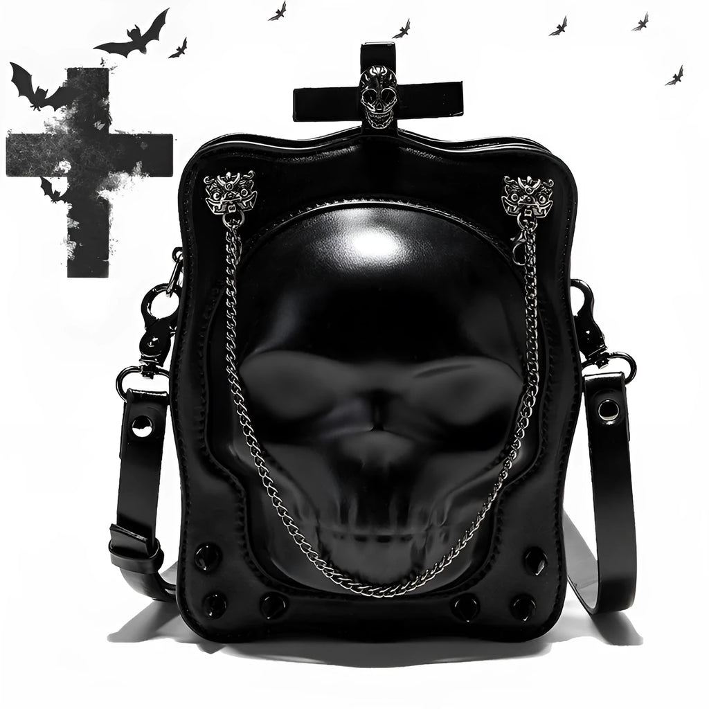 Black square mini crossbody bag with embroidered skull design, metal rivets, and a chain shoulder strap.