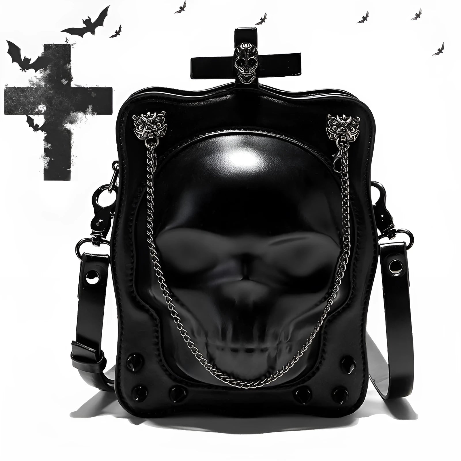 Black square mini crossbody bag with embroidered skull design, metal rivets, and a chain shoulder strap.