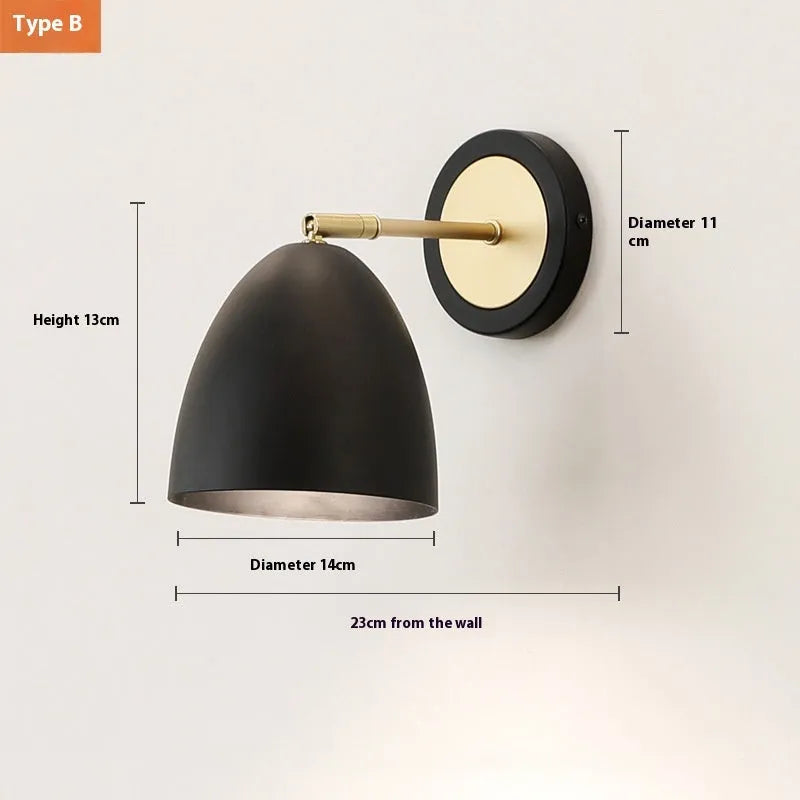 Nordic style iron wall lamp mounted on a wall, showcasing its welded shade design.