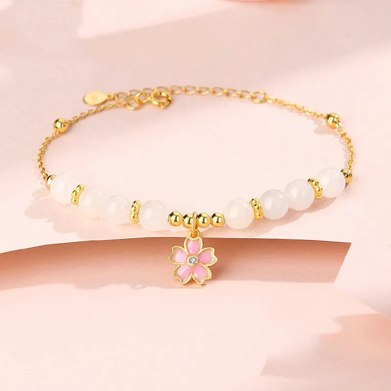 Pink gradient Hetian jade and 925 silver bracelet with epoxy cherry blossom pendant.