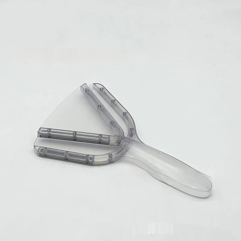 Red plastic telescopic can and bottle opener with non-slip handle on a kitchen counter.