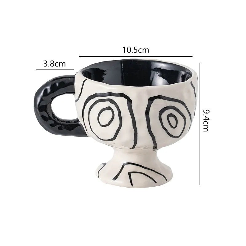 Hand-pinched irregular ceramic mug in a solid colour, showing its unique shape.