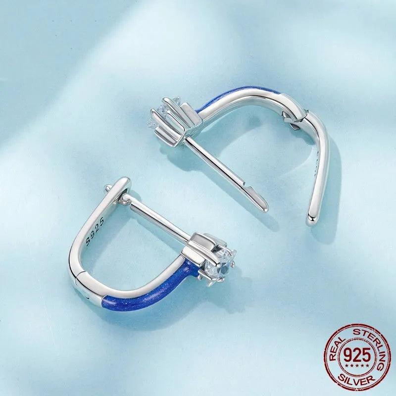 Pair of 925 sterling silver blue star pentagram ear clips with drip oil finish on white background