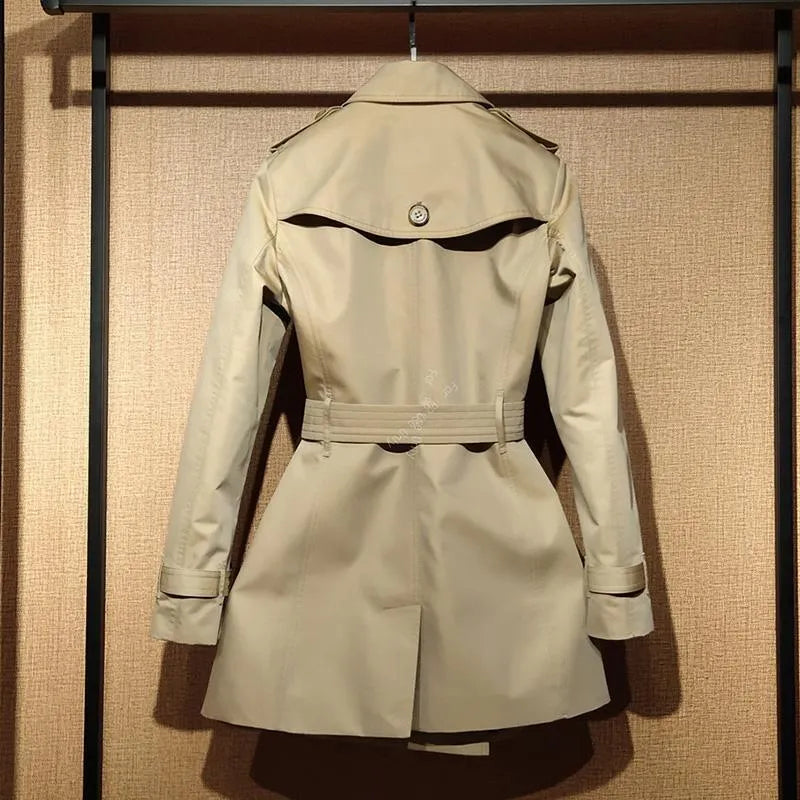 Khaki double-breasted trench coat for women with flight sleeves and button details.