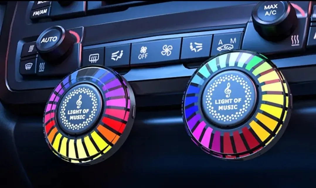 Car air vent aromatherapy light with RGB LEDs and voice control on a car dashboard.