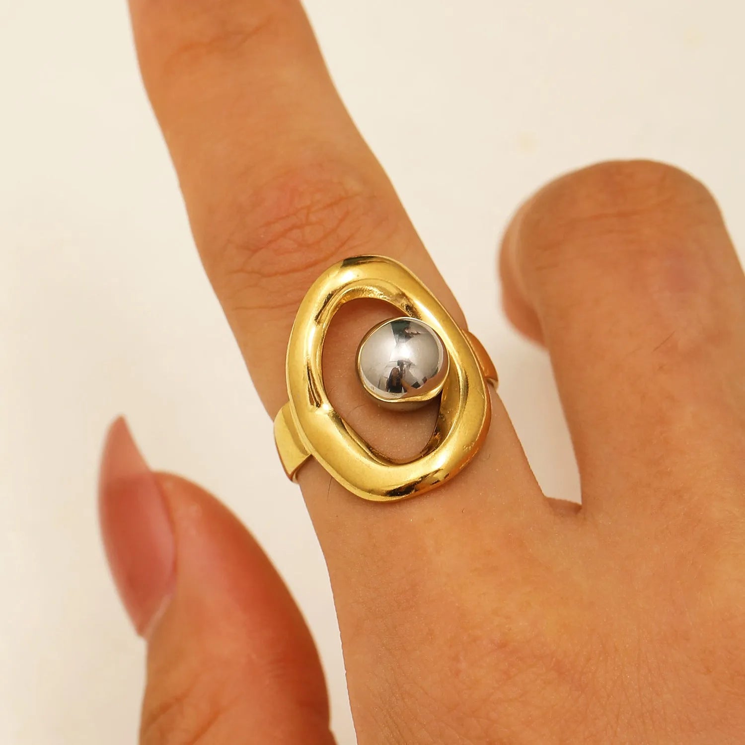Stainless steel geometric open ring with 18K real gold finish and hollow line detail