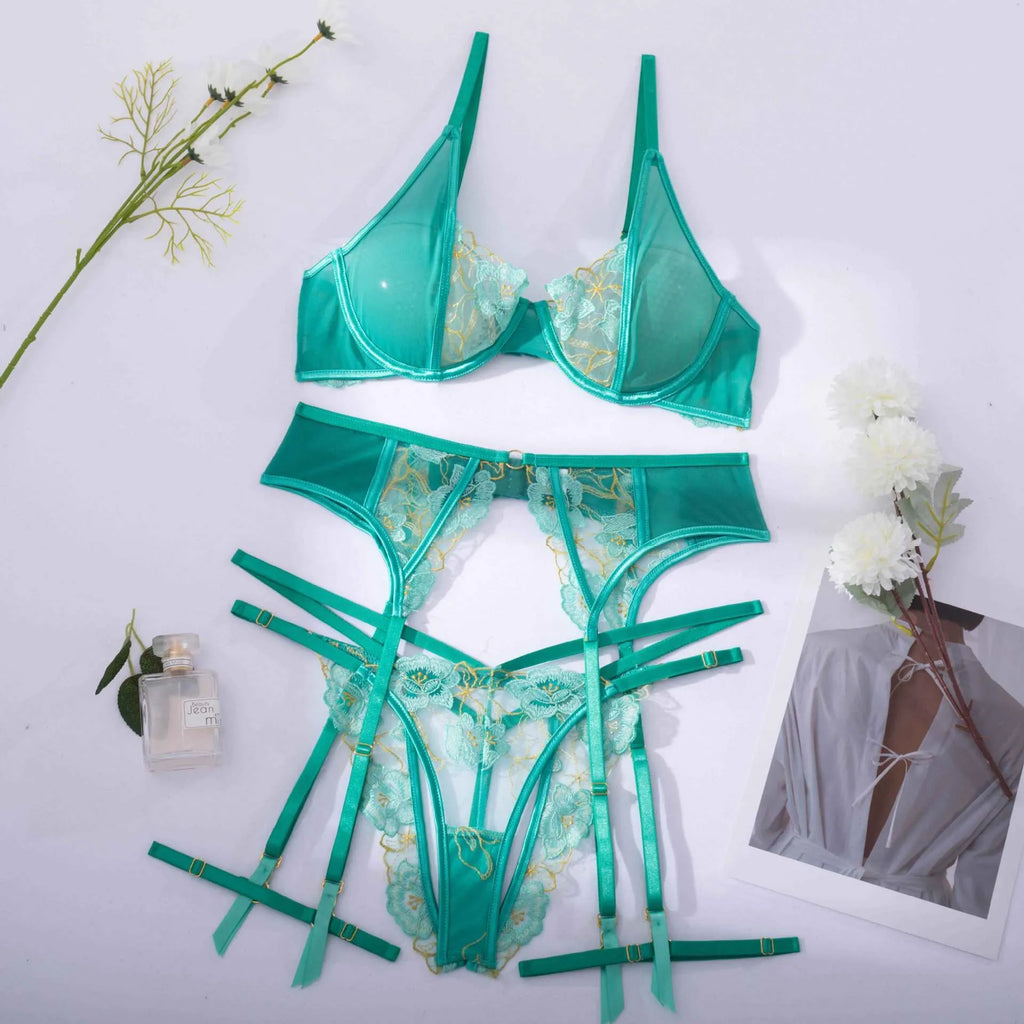 Light green women's embroidered bra and matching briefs set on a white background.