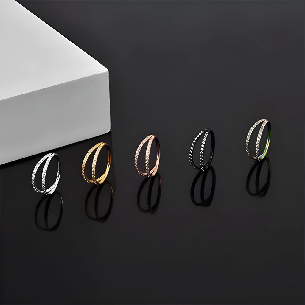 G23 titanium alloy nose ring with zircon detail in gold and steel colours, showing 1.0mm and 1.2mm diameter options.