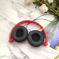 Black foldable wired over-ear headphones with an adjustable headband and a 3.5mm plug.