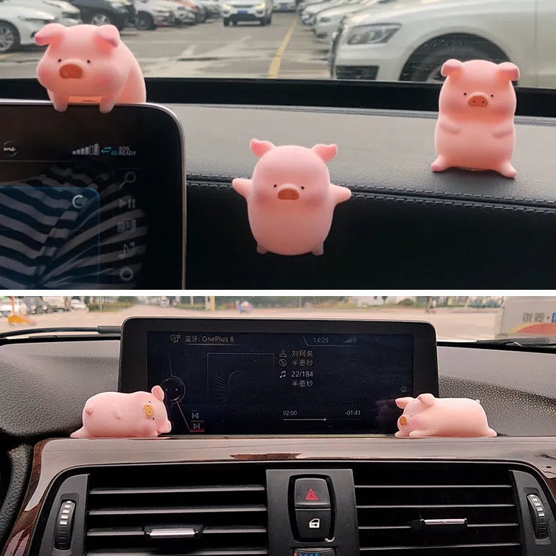 Set of eight cute cartoon pig resin car dashboard decorations on a car console