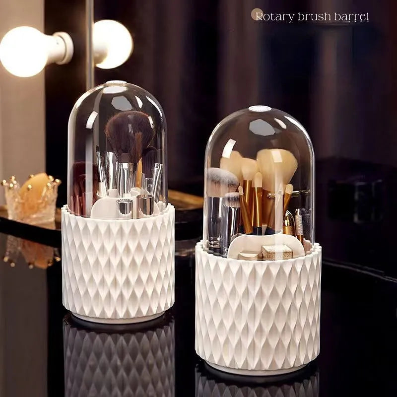 White rotating acrylic makeup brush storage box with transparent dust cover on desktop