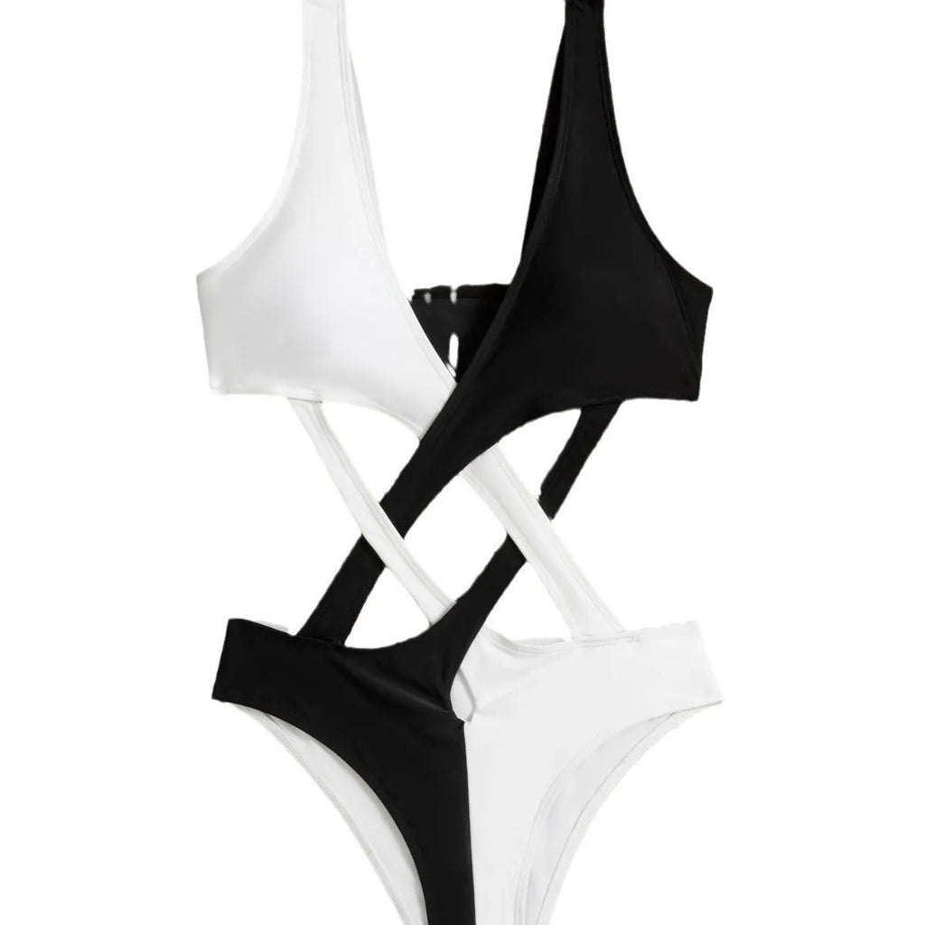 White women's one-piece swimsuit with colour-blocking and hollow-out design details.