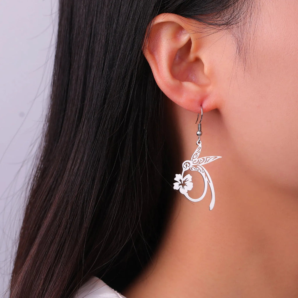 Pair of stainless steel hummingbird earrings with hollow openwork design, available in gold or steel colour