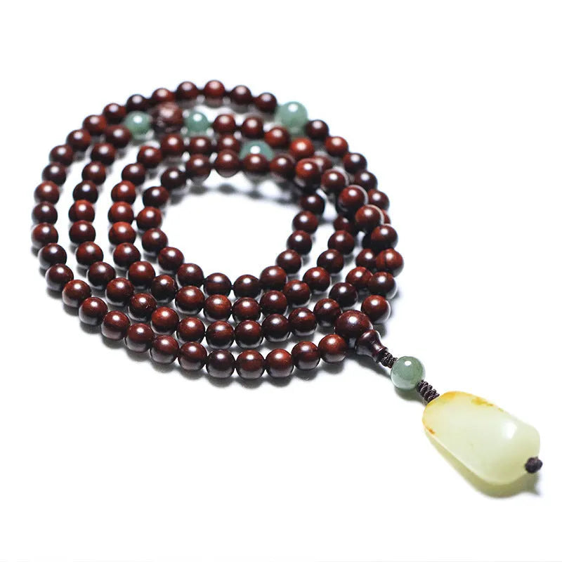 Rosewood bead bracelet with 108 beads and a carved green Hotian jade pendant.